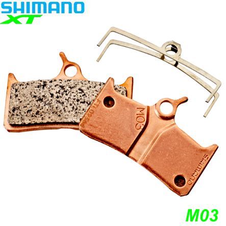Shimano Bremsbeläge M03 Metall mit Feder und Clip Paar Blister